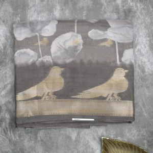 green silk paisley print saree with gold border