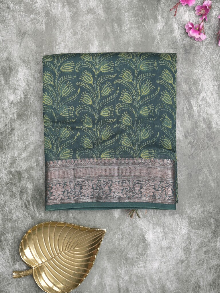 green silk paisley print saree with gold border